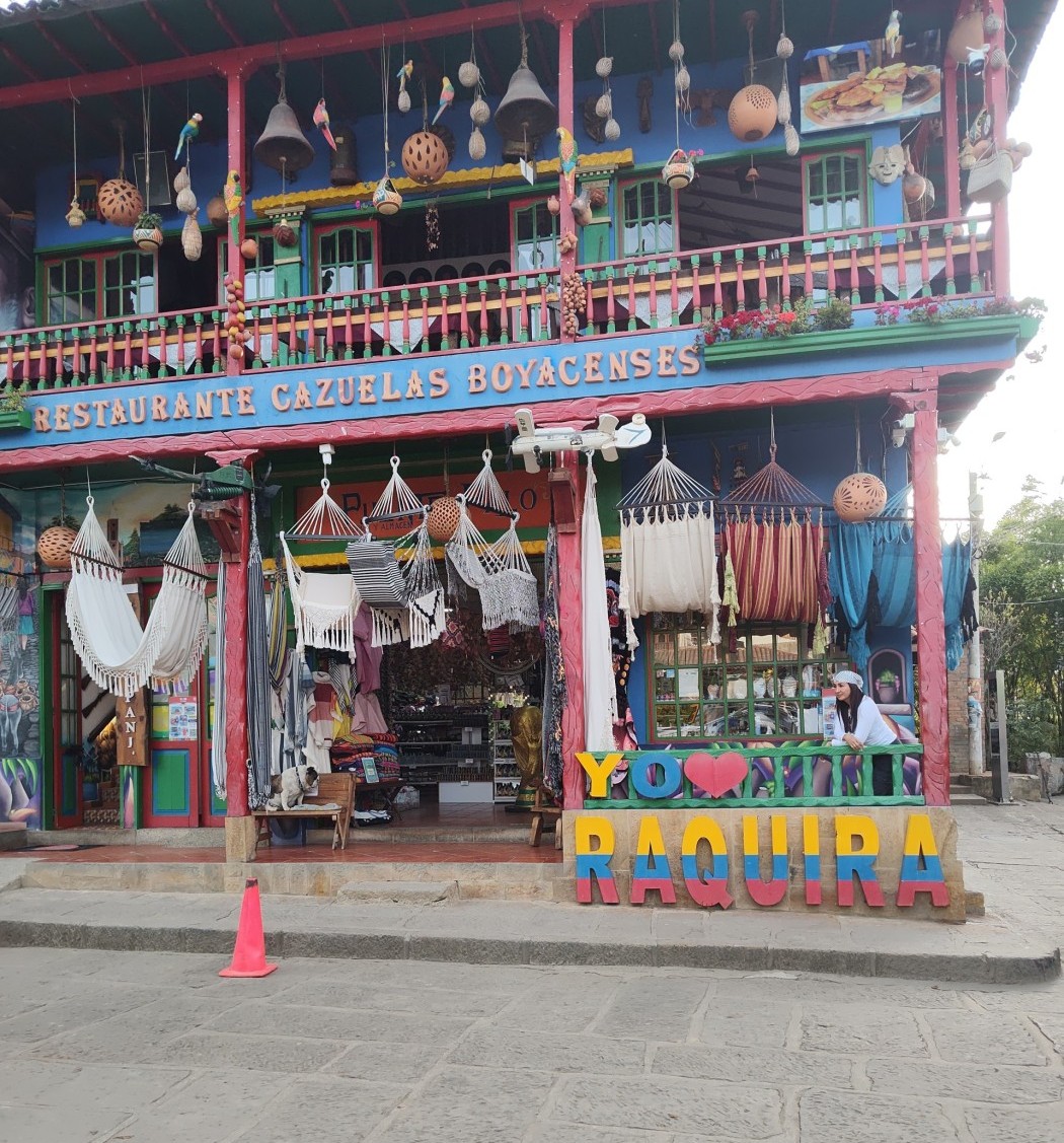 Ráquira Colombia downtown restaurant and sign with lady